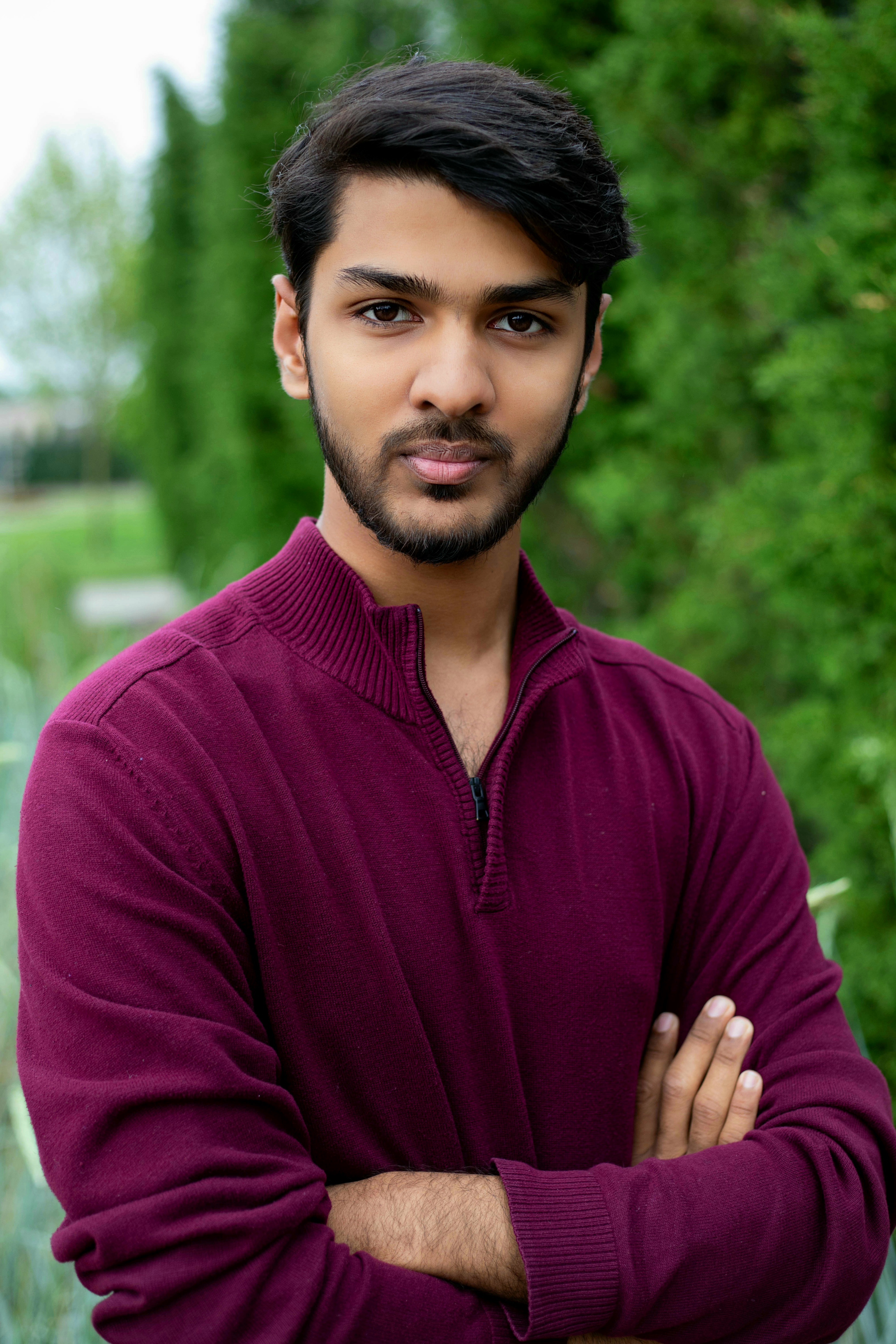 A man in a alice blue shirt with a thinking expression